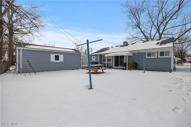 view of snow covered house