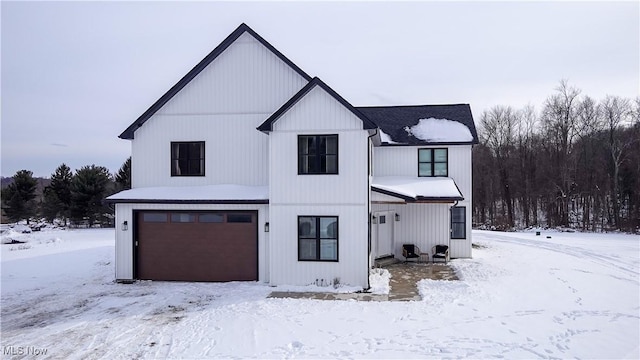 modern farmhouse style home with a garage