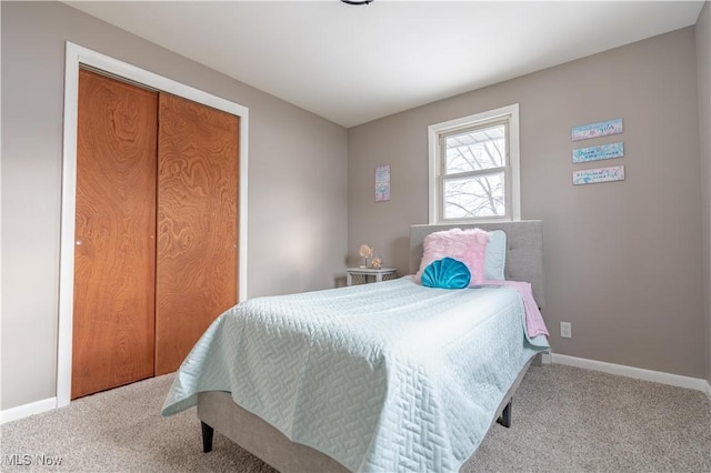 carpeted bedroom featuring a closet