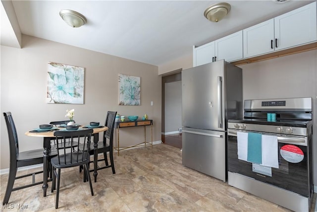 kitchen featuring white cabinetry and stainless steel appliances