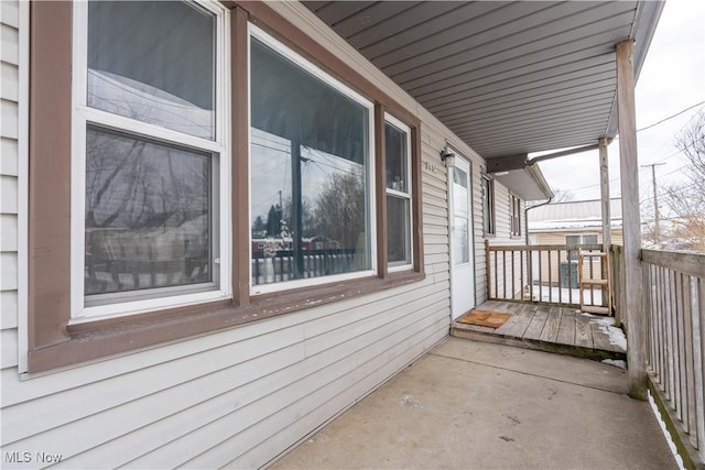 view of side of home featuring a porch