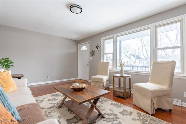 living room with hardwood / wood-style flooring and baseboard heating