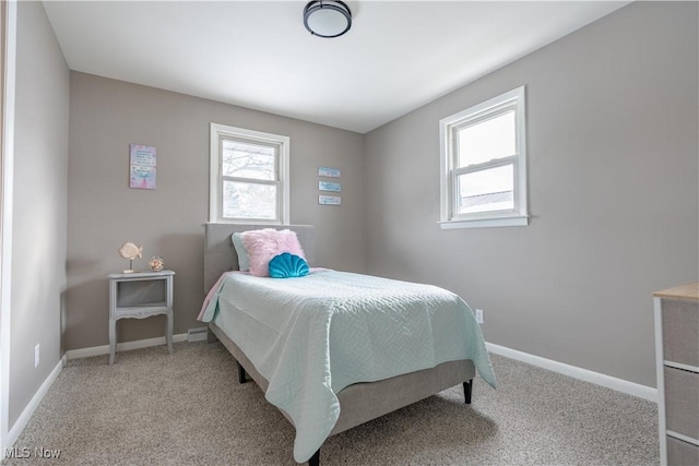 bedroom featuring light colored carpet