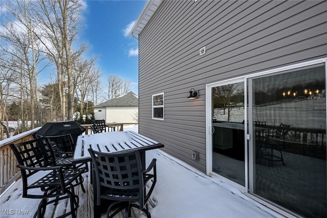 view of snow covered deck