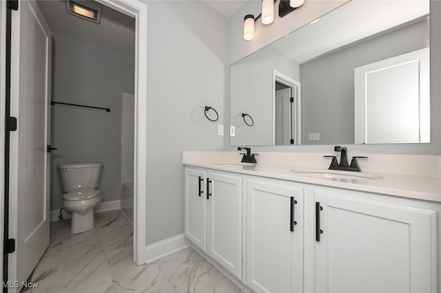 bathroom featuring vanity, toilet, and a bathing tub