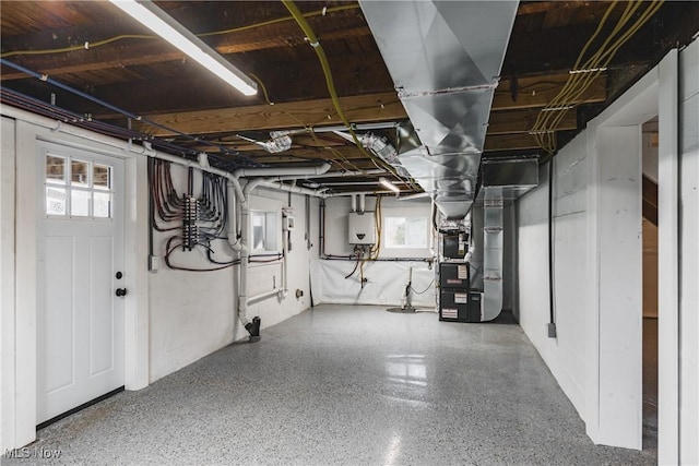 basement with water heater and heating unit