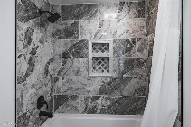 bathroom with shower / bath combination with curtain