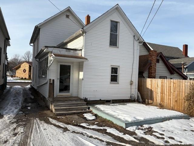 view of snow covered house