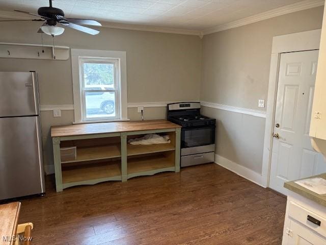 kitchen with crown molding, ceiling fan, stainless steel appliances, dark hardwood / wood-style floors, and white cabinets