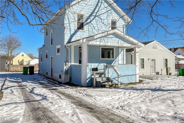 view of snow covered house