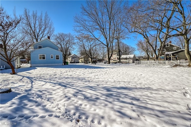 view of yard covered in snow