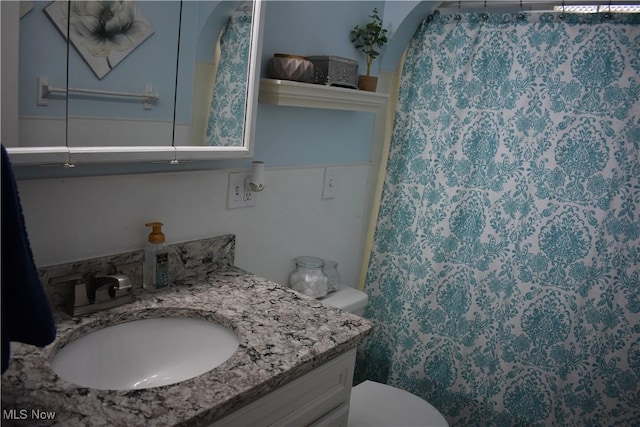 bathroom with vanity and toilet