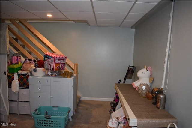 laundry room featuring dark carpet