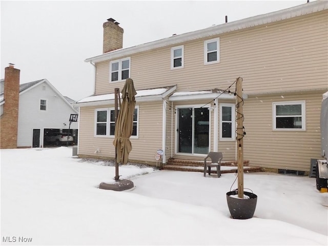 view of snow covered house