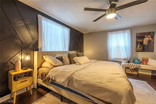 bedroom featuring ceiling fan and dark hardwood / wood-style flooring