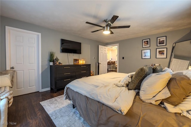 bedroom featuring ceiling fan and dark hardwood / wood-style flooring