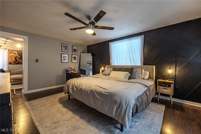 bedroom featuring dark hardwood / wood-style floors and ceiling fan