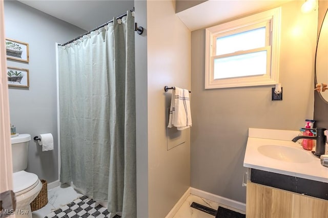 bathroom featuring vanity, toilet, and a shower with shower curtain