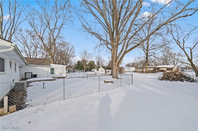 view of yard covered in snow