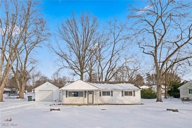 view of front of property featuring an outbuilding and a garage