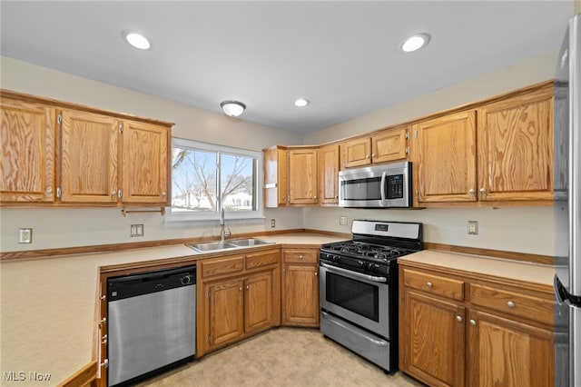 kitchen with appliances with stainless steel finishes and sink