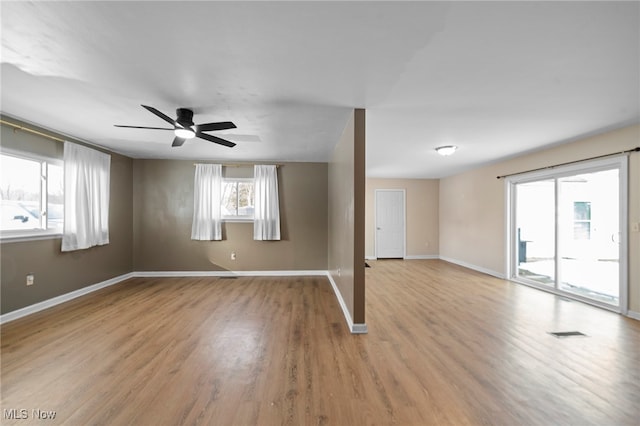 empty room with hardwood / wood-style flooring and ceiling fan