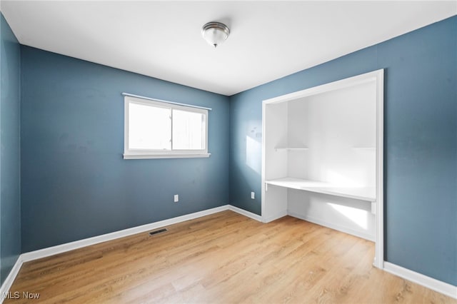 unfurnished bedroom with light hardwood / wood-style floors