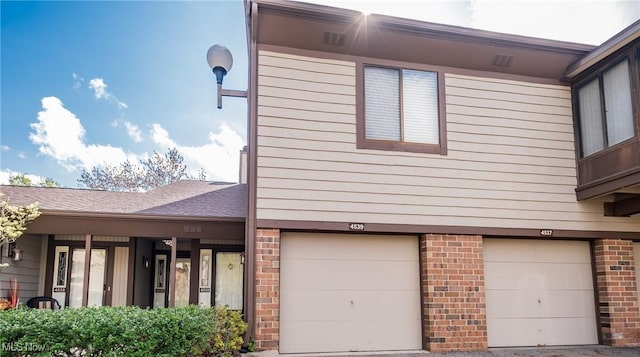 view of property exterior featuring a garage