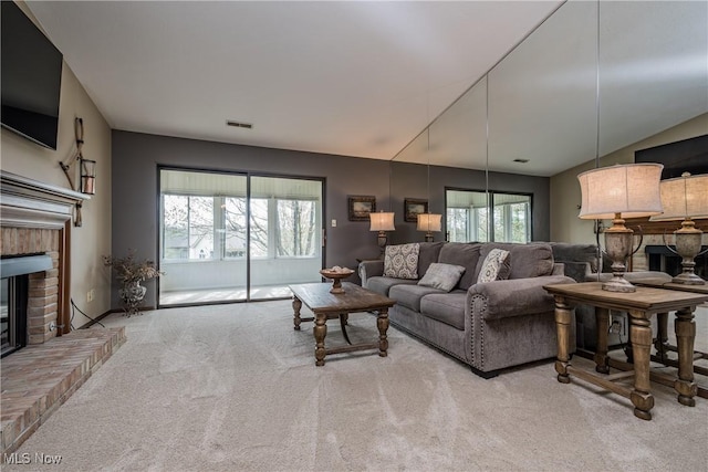 4539 Saint James Cir NW, Canton, OH 44708 - living room with light colored carpet and a brick fireplace
