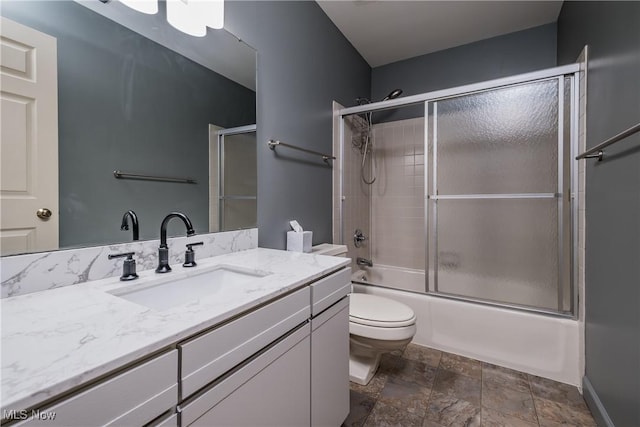 4539 Saint James Cir NW, Canton, OH 44708 - full bathroom featuring vanity, shower / bath combination with glass door, and toilet