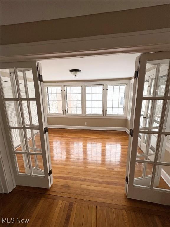 interior space featuring hardwood / wood-style floors and plenty of natural light