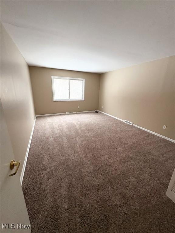 empty room featuring carpet floors