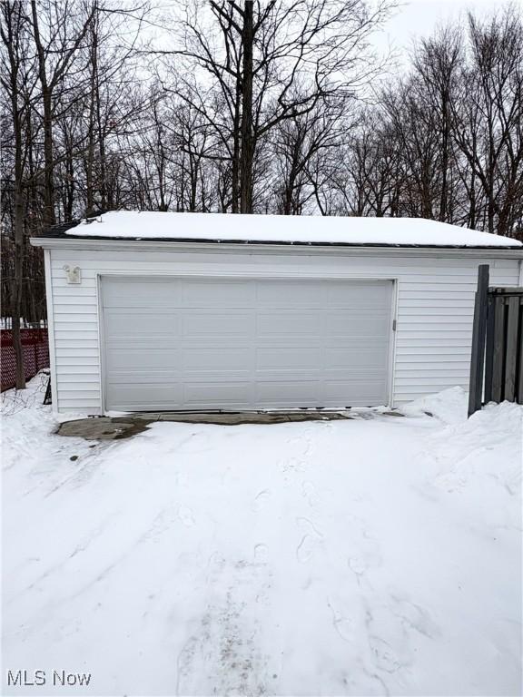 view of snow covered garage