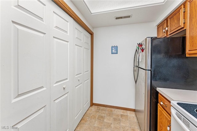 kitchen with white range with electric cooktop