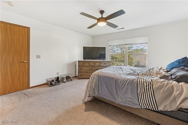 carpeted bedroom featuring ceiling fan