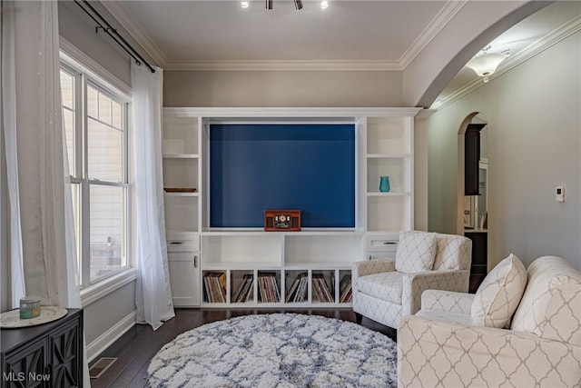 sitting room featuring ornamental molding and dark hardwood / wood-style floors