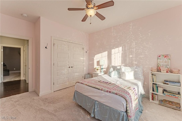 bedroom featuring a closet, ceiling fan, and carpet flooring