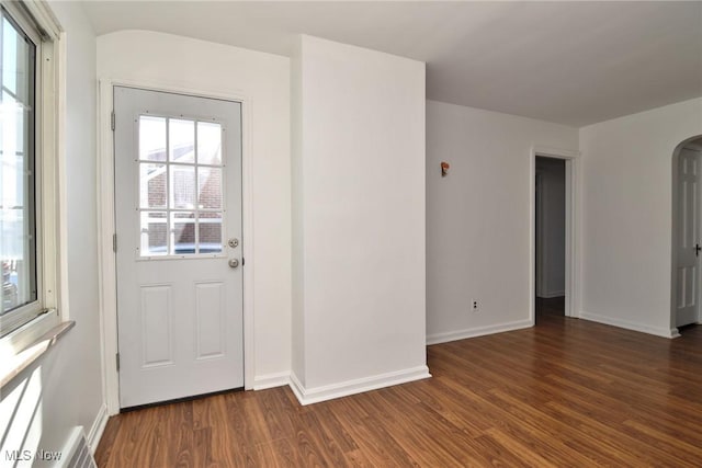 foyer entrance featuring dark hardwood / wood-style floors