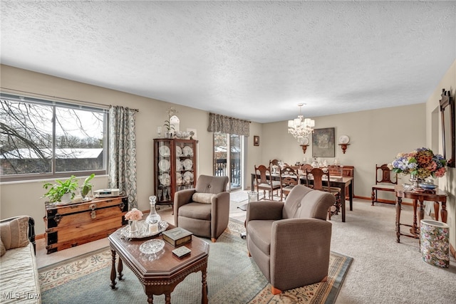 carpeted living room featuring an inviting chandelier and a textured ceiling