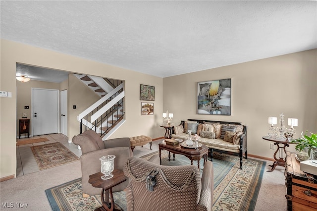 carpeted living room with a textured ceiling