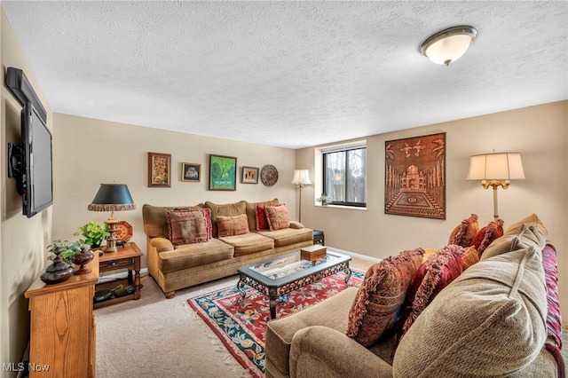 living room featuring light carpet and a textured ceiling