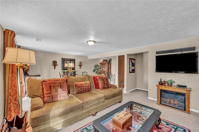 living room featuring carpet floors and a textured ceiling