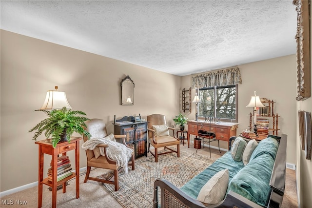 living room featuring light carpet and a textured ceiling