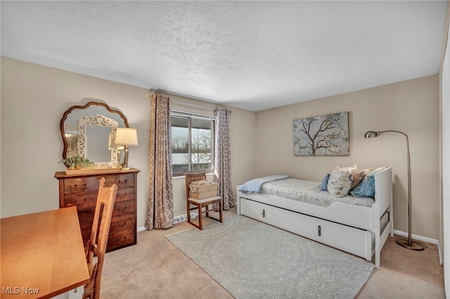 carpeted bedroom with a textured ceiling