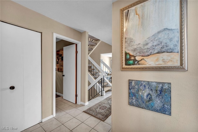 hallway featuring light tile patterned floors