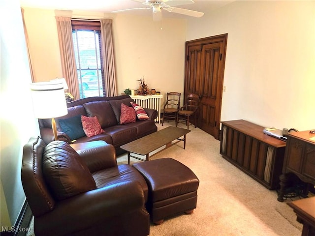 living room with ceiling fan and light carpet