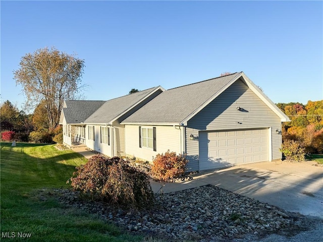 view of property exterior featuring a yard and a garage