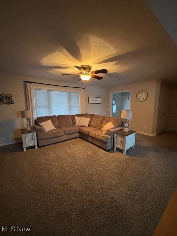 carpeted living room with ceiling fan