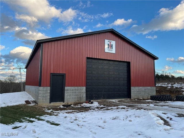 view of snow covered garage