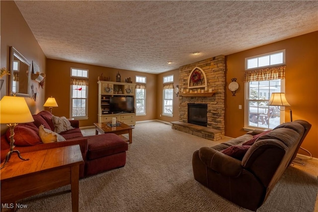 living room with carpet, a wealth of natural light, a textured ceiling, and a fireplace